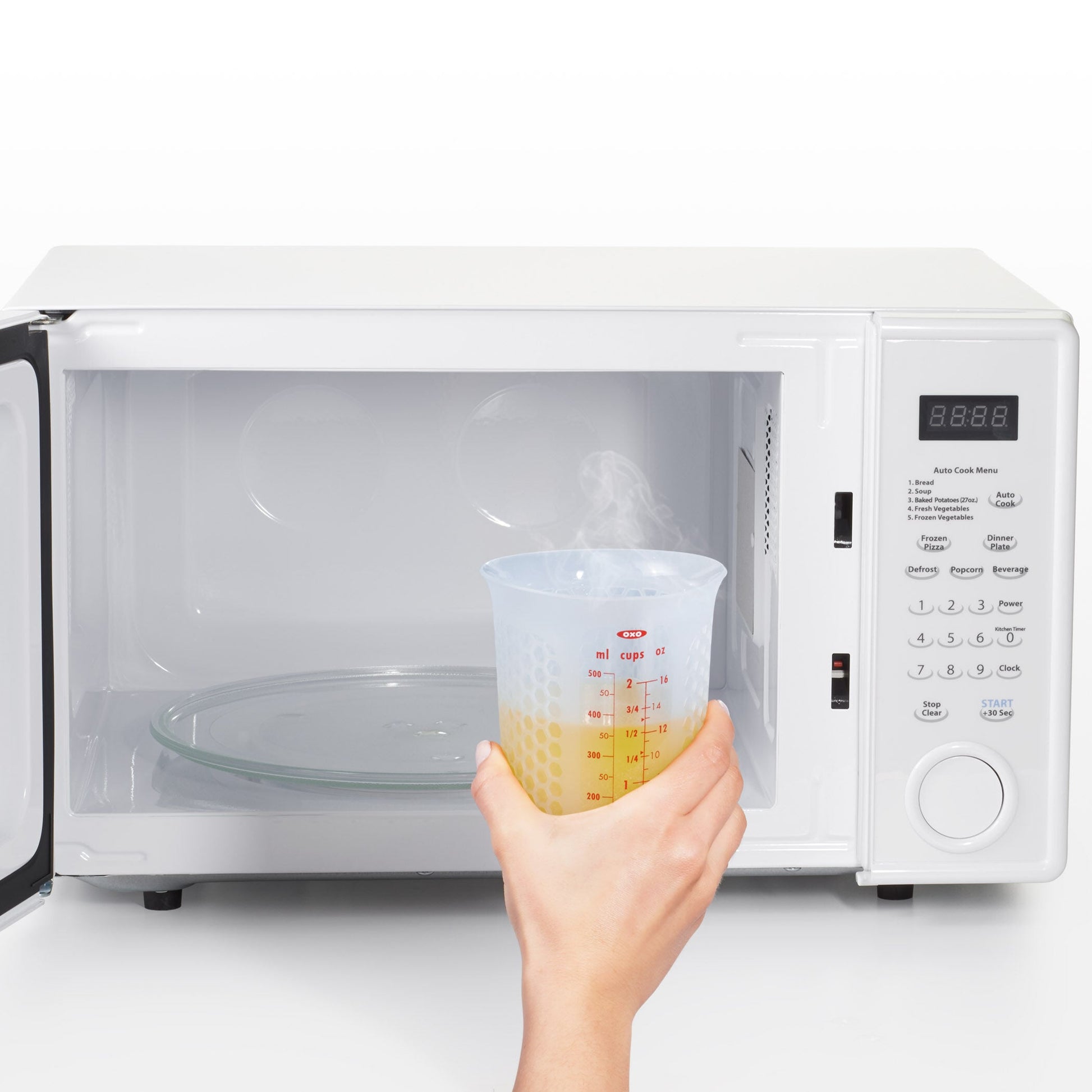2-cup-squeeze-and-pour-silicone-measuring-cup-y5 oxo_good_grips_silicone_measuring_cup_-_in_microwave.jpg